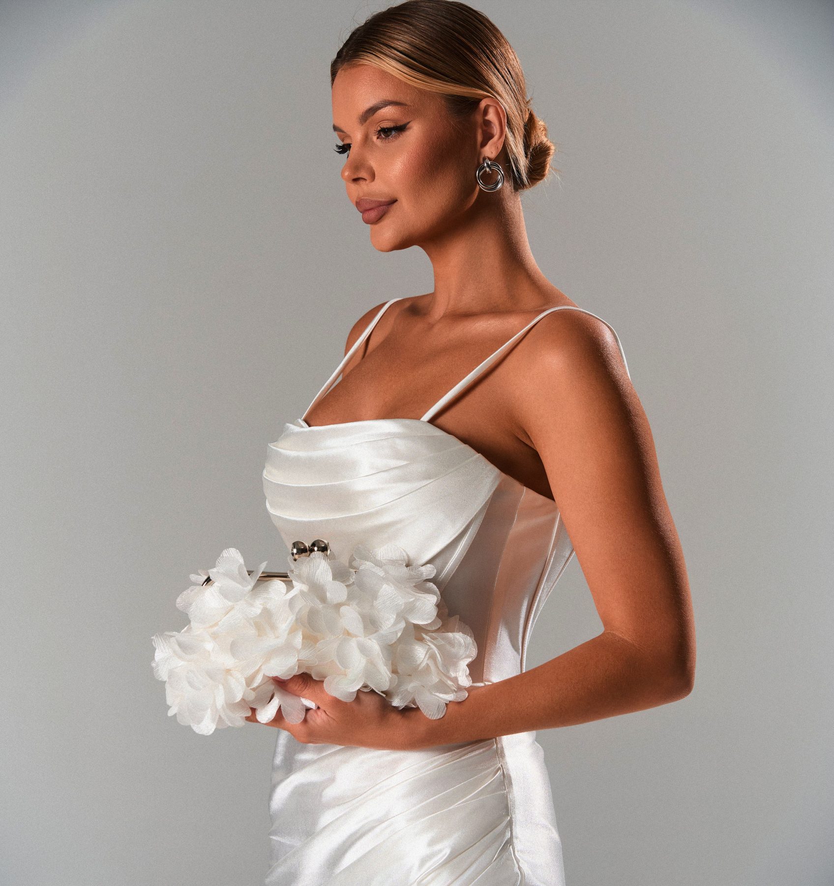 Ivory satin bridal gown with floral detail