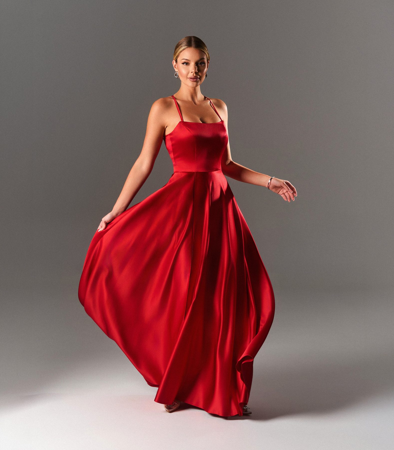 Red satin gown in motion