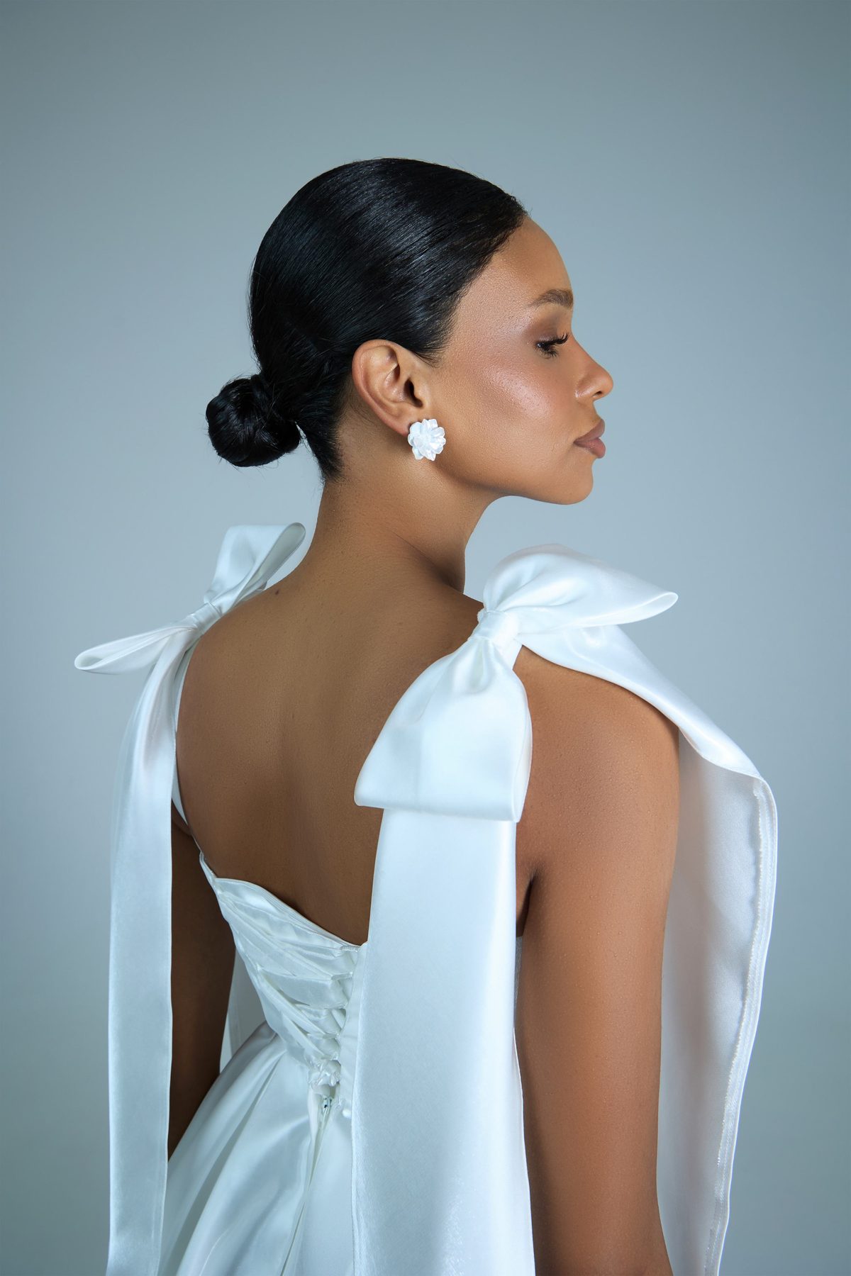 White bow accents on open back