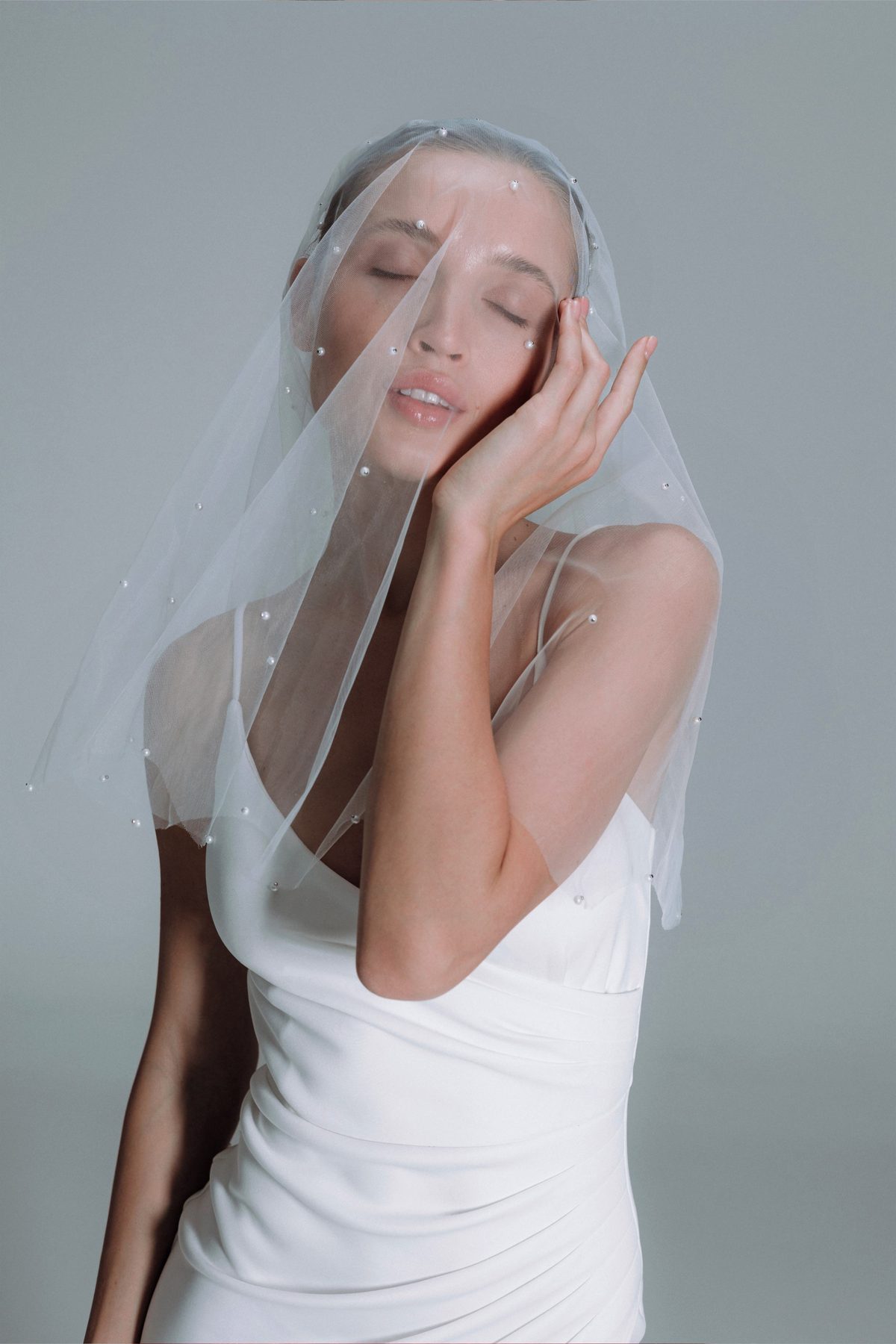 Soft pearl-dotted veil draping